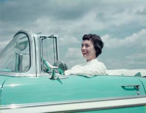 Woman driving 1956 Chevrolet Bel Air Convertible